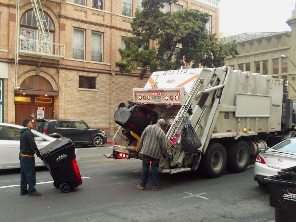 Collecting garbage in downtown San Diego while many still sleep.