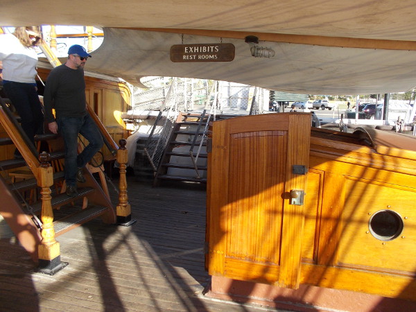 Visitors descend from the poop deck. Beautiful woodwork is found all about the ship. But the elements can be harsh.