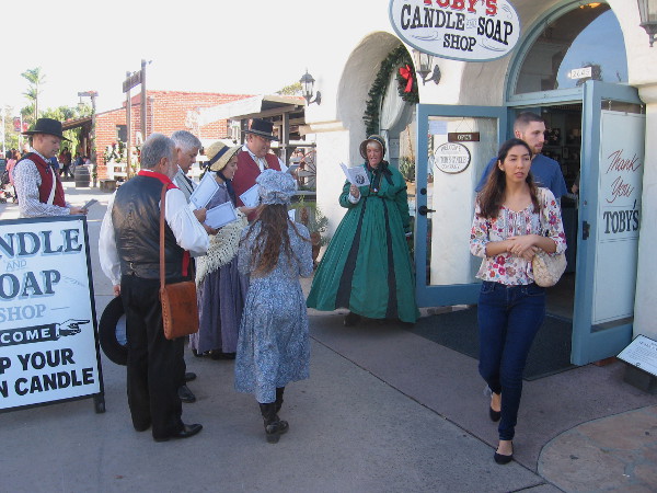 Joyful, uplifting Christmas carols are sung as customers leave Toby's Candle and Soap Shop.