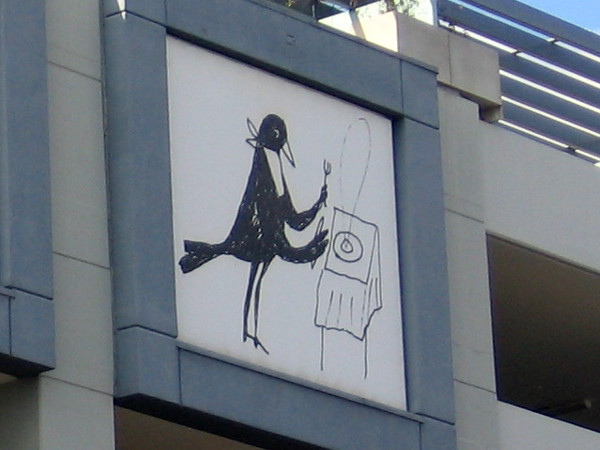 A bird in a bib ready to chow down.