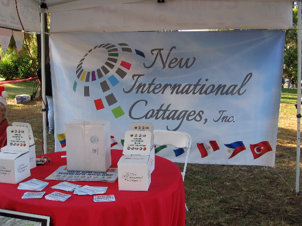 New International Cottages display explains expansion plans in Balboa Park. Photo taken during December Nights.