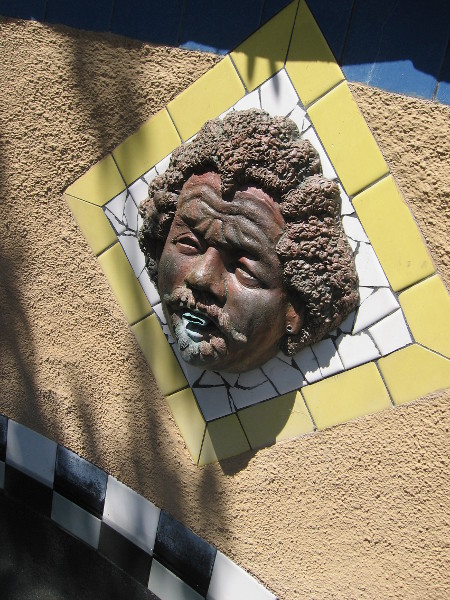 An artistic face in a fountain by the Old Globe Theatre.