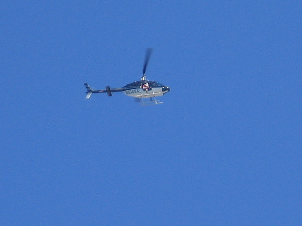 Santa Claus is ready to leap from a helicopter onto the deck of the USS Midway aircraft carrier museum on San Diego Bay!