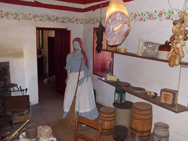 A variety of dried food hangs from the ceiling. The kitchen of the Commercial Restaurant museum in Old Town is a place where visitors are transported back in time.