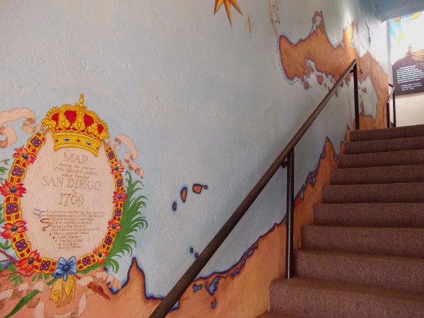 Stairs lead up to the Serra Museum's tower. Painted on the wall is a map showing the sea journey of the Spanish Expedition which founded San Diego in 1769.