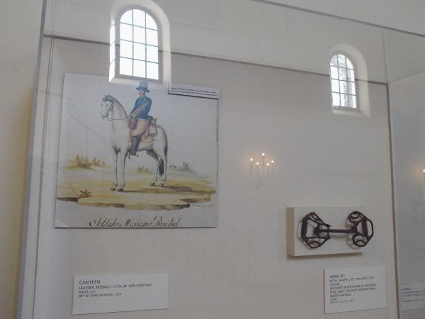 Artistic rendition of a Mexican presidio soldier circa 1830, and a horse's bit.