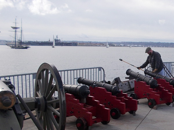 The Maritime Museum employee quickly loads one of the land battery cannons, and gets ready to fire! That pirate won't get away so easily!