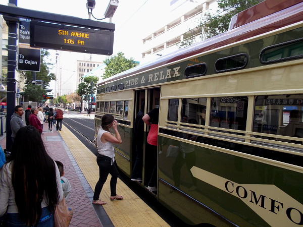 A couple passengers will take a ride on this restored PCC streetcar, of the San Diego Trolley. I joined them!