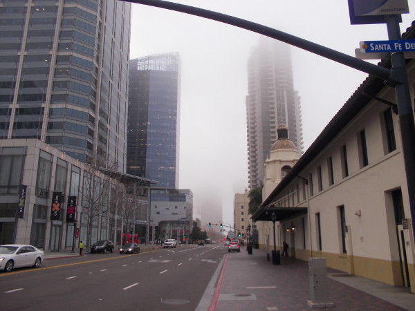 Looking down Kettner Boulevard past Santa Fe Depot and America Plaza into the distant fog.
