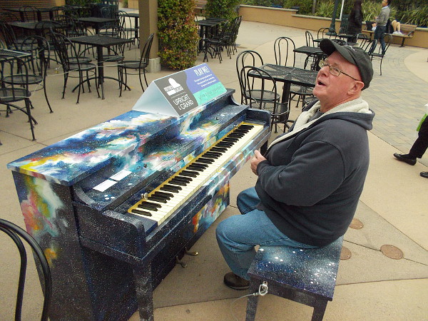 And finally, the magic piano bench. Anybody can sit here and play through January, courtesy of the San Diego Symphony's PLAY ME: Pianos In Public Spaces event.