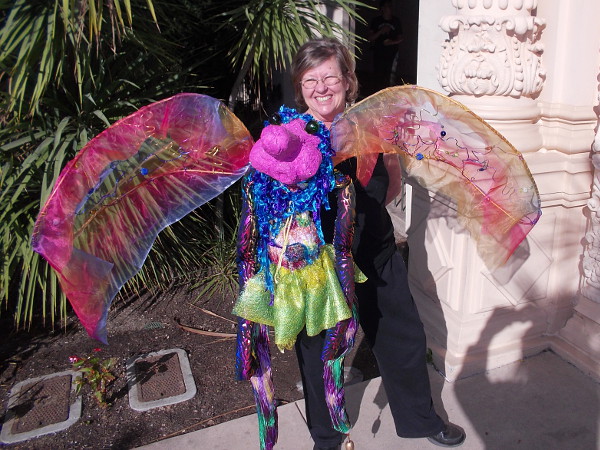 A fairy puppet and smiling puppeteer pose for my camera in San Diego's wonder-filled Balboa Park.