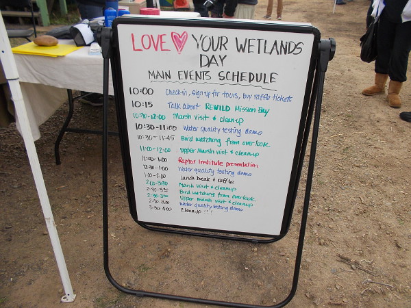 A sign welcomes visitors to Love Your Wetlands Day. Lots of activities included bird watching, a water quality test demo, and a marsh clean-up.