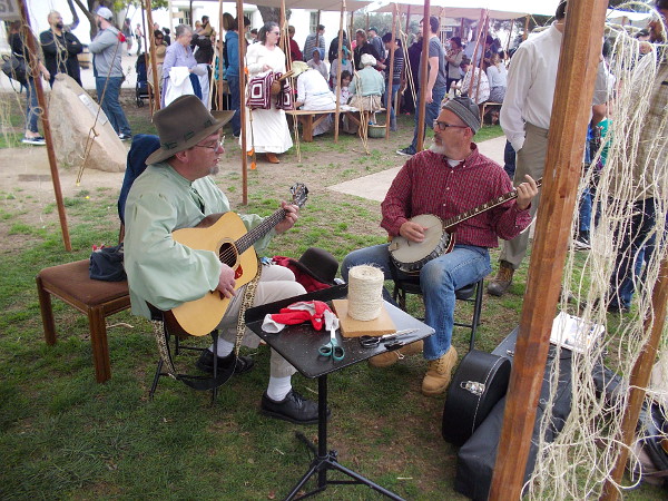 A guitar and a banjo create upbeat frontier-style music