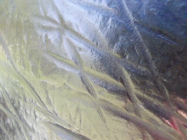 A strangely perfect, silvery surface.