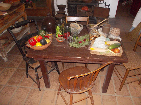 A table full of peppers and vegetables. What life was like many generations ago, in the kitchen of Old Town's Commercial Restaurant museum.