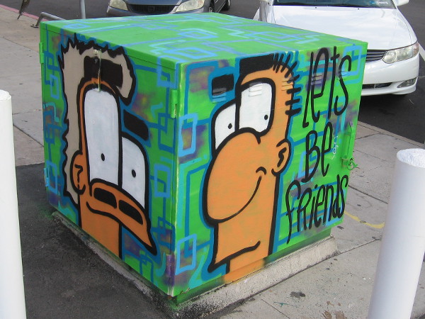 Let's be friends. Two cool faces on a transformer box in North Park.