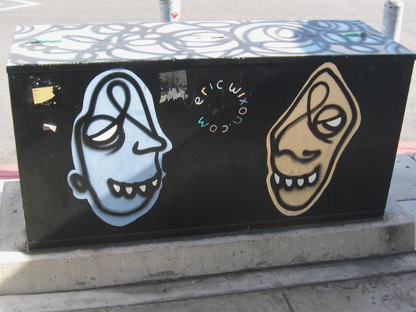 Abstract faces look at each other.