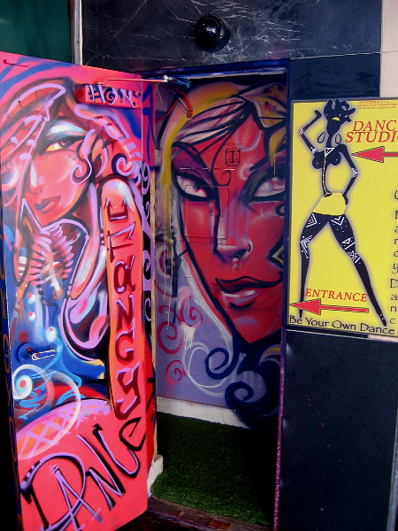 Funky, eye-catching urban art brightens the entrance to a dance studio.
