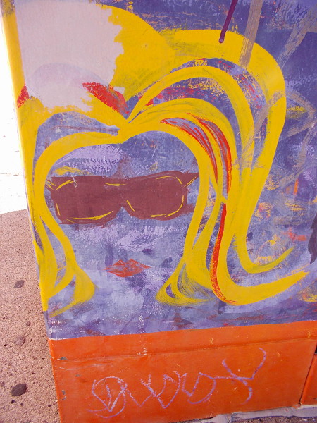 A painted blonde with cool sunglasses.