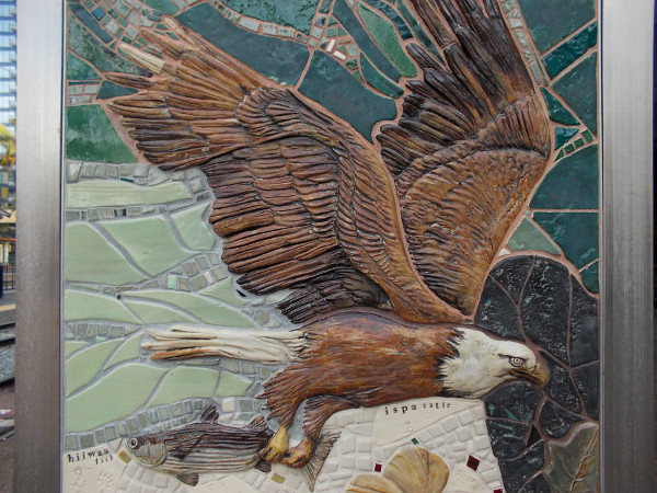 Beautiful handmade mosaic tiles show a Kumeyaay ispa (eagle) in flight.