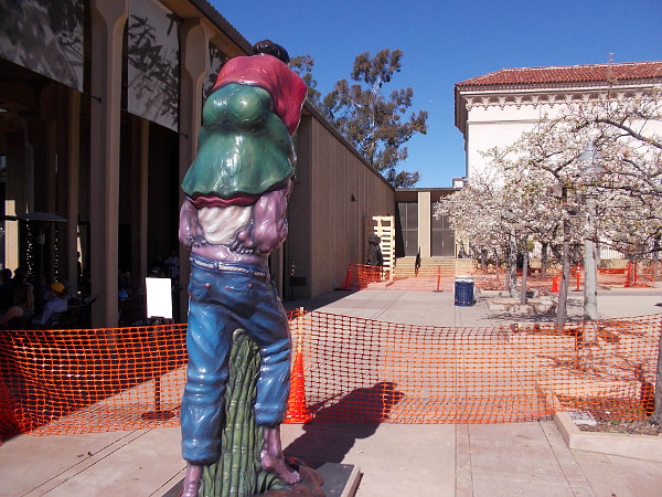 A large sculpture seems to stride into the life-filled Plaza de Panama in San Diego's historic Balboa Park.