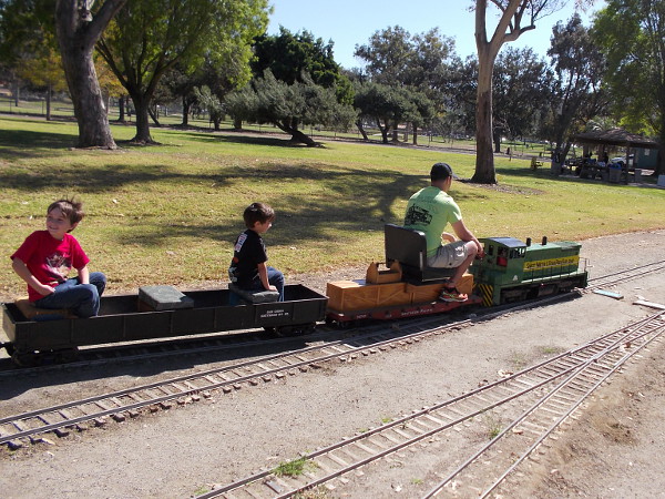 Thrilled kids ride behind a small diesel locomotive, which is actually powered by gasoline. The tracks looping through the park provide a fun, scenic ride.