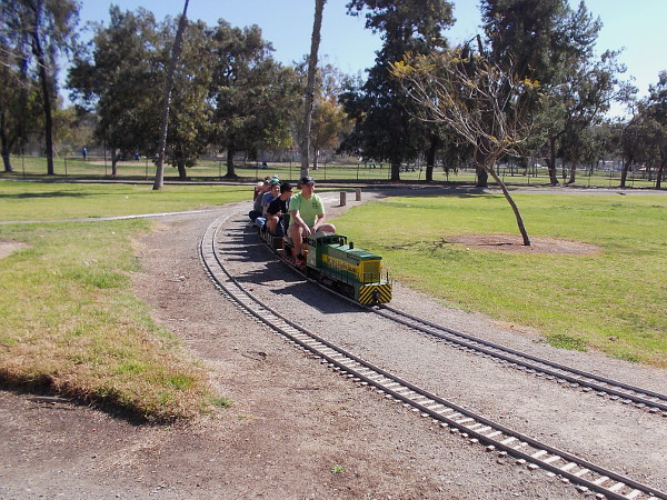 Here comes the same train. The Bonita Golf Course is in the distance, beyond the tracks.