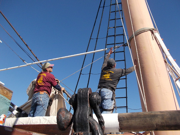 These guys are working above the forward house near the foremast.
