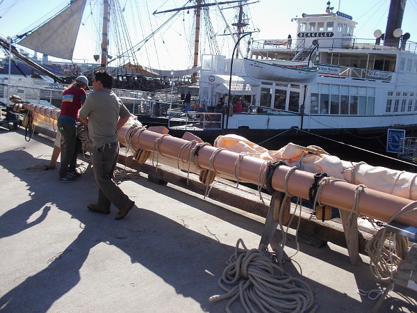 Another yard to be installed on the San Salvador by crane awaits on the Embarcadero. This heavy yard with sails furled will be supported by the replica Spanish galleon's foremast.