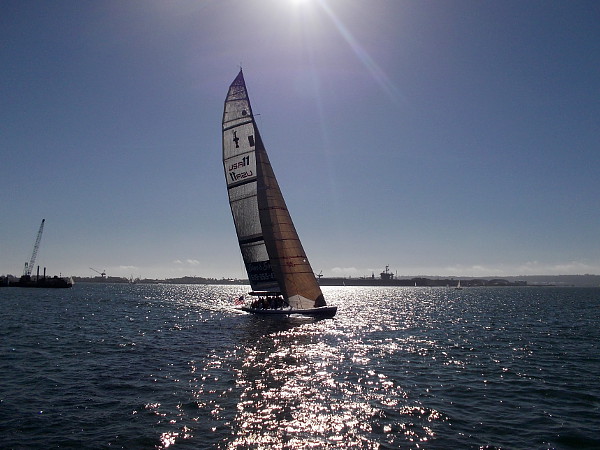 I heard no sound as a large sailboat approached.