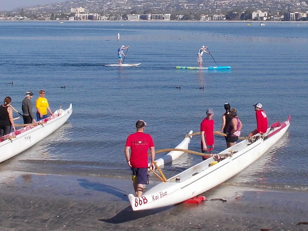Some folks enjoying standup paddleboarding on Mission Bay also viewed the fascinating launch.