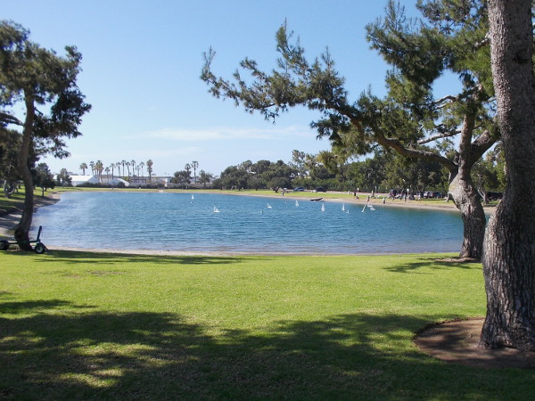 Radio control model sailboats cross the Model Boat Pond on Vacation Isle.