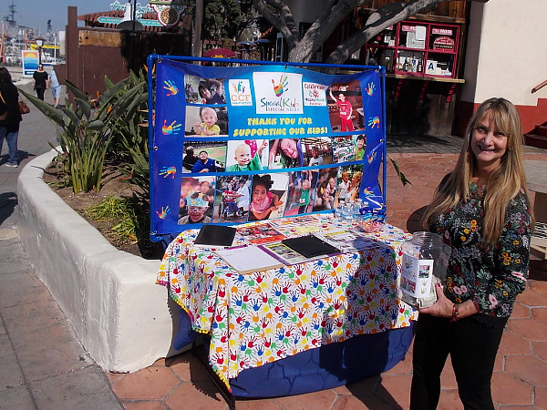 This wonderful, smiling lady is spreading sunshine. She's trying to help unfortunate kids live a better life, with days full of joy and happiness. Can you help