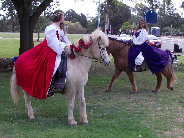 Irish damsels on horseback linger before start of the 2016 St. Patrick's Day Parade in San Diego.