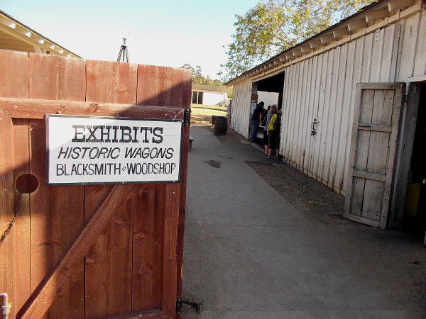 Beyond this gate just off La Plaza de Las Armas is the yard behind Seeley Stable. Here you'll find outdoor exhibits, including old wagons and a blacksmith and woodshop.