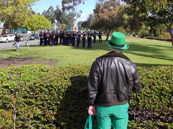 Someone watches as members of local United States Marine Corps band practice. Photo taken near Balboa Park's lawn bowling green.