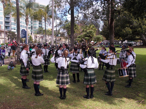 Bagpiper players and drummers form a circle as they practice for the big parade.