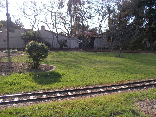 The old east entrance (under the tiles) is now blocked off. Much of the grassy area used by today's Balboa Park Miniature Railroad used to be a parking lot.