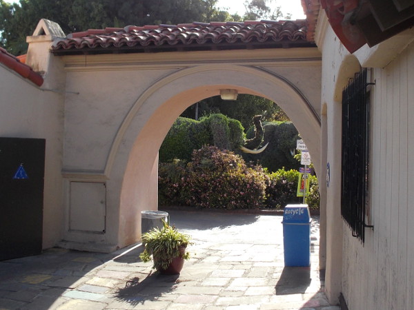 Looking through the west archway toward a shrub elephant, which stands on a nearby, newly improved walkway the heads north to the San Diego Zoo.