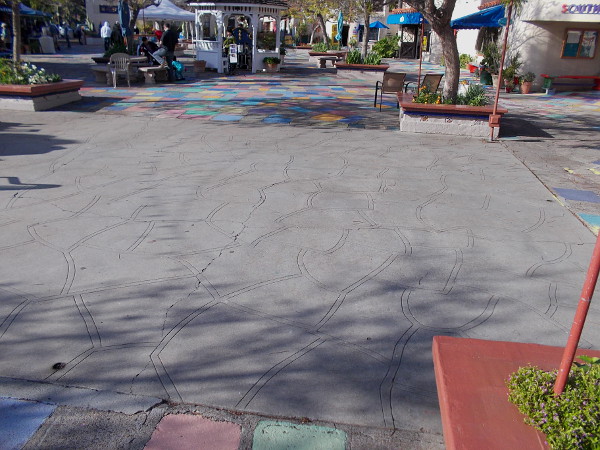 This large dance floor (and the area where I'm standing) at the center of the colorful Spanish Village patio was once occupied by a large building. It seems there is some debate what that building was, exactly.