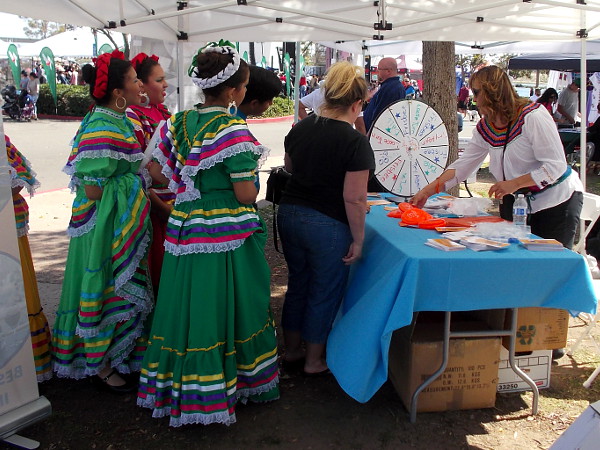 These ladies in costume were taking their turns at one of the festival's many prize wheels!