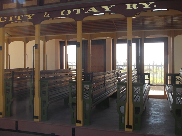 The restored coach features outdoor bench seating and beautiful woodwork. Passengers could ride this car from San Diego through National City and Chula Vista to the Mexican border.