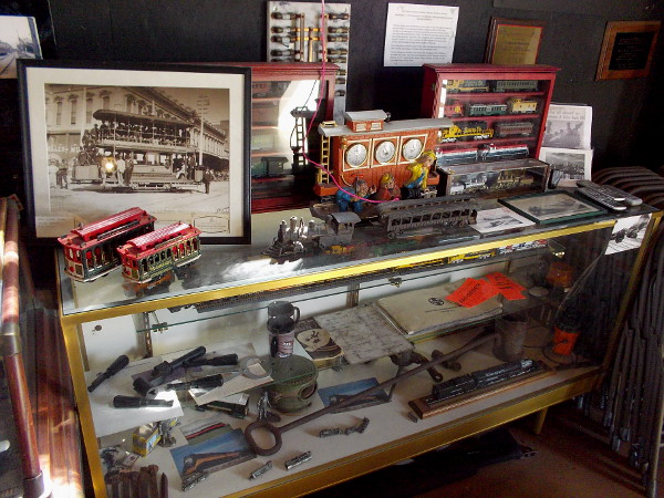 Inside the small depot are display cases full of model trains and streetcars, plus artifacts and memorabilia. The walls are covered with old photos and historical information.