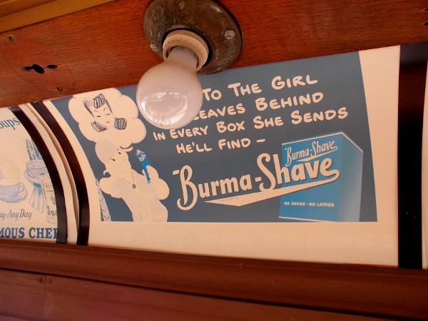 Cool vintage advertisements along the car's ceiling include this one for Burma-Shave.