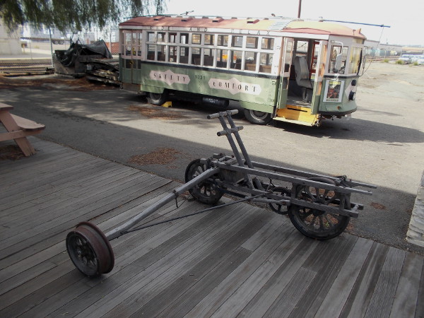 This unusual three-wheeled handcar reminds me of a canoe outrigger!