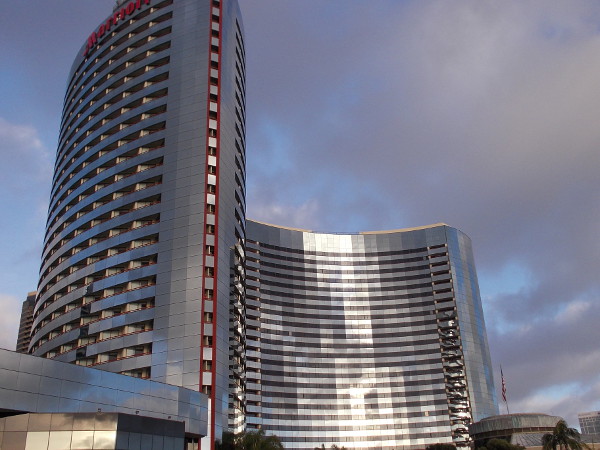 Late afternoon sunlight reflected off the two silvery sail-like towers of the Marriott Marquis on San Diego Bay.