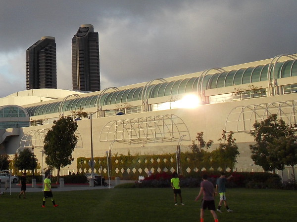 End of day approaches. The sun sets fire to a glass portion of the San Diego Convention Center.