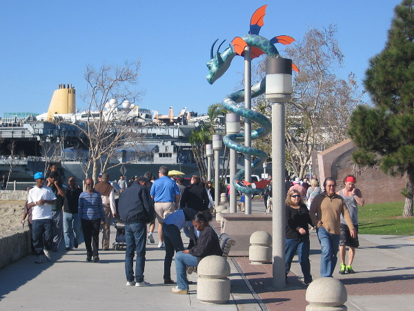 Visitors to San Diego's Embarcadero walk past a looming dragon!