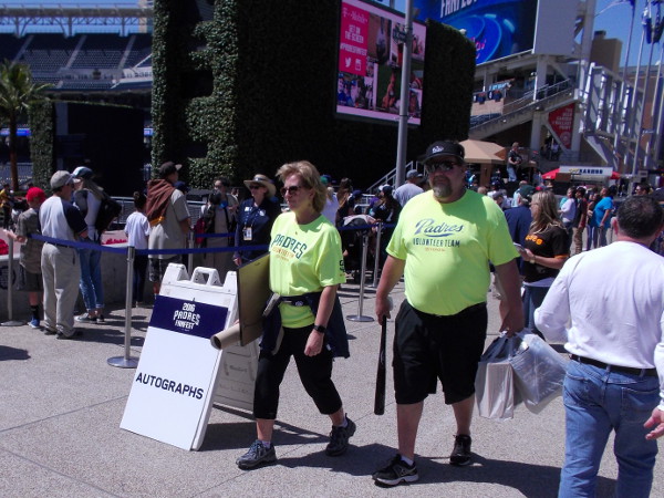 Popular professional baseball players were signing autographs for San Diego fans.