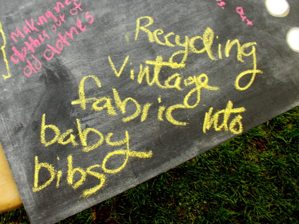 Recycling vintage fabric into baby bibs.